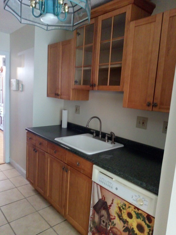 81 Mitchell Drive, Unit 81 Chicopee, MA 01022 - Photo 5 of 18 a kitchen with stainless steel appliances granite countertop a sink stove and cabinets