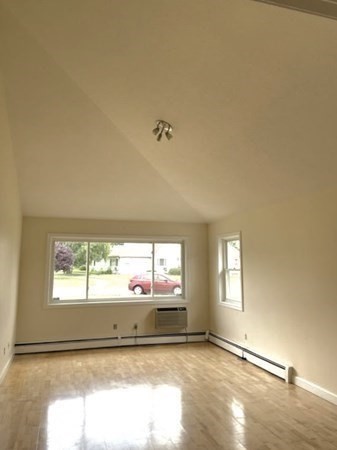 81 Mitchell Drive, Unit 81 Chicopee, MA 01022 - Photo 6 of 18 a view of an empty room and a window