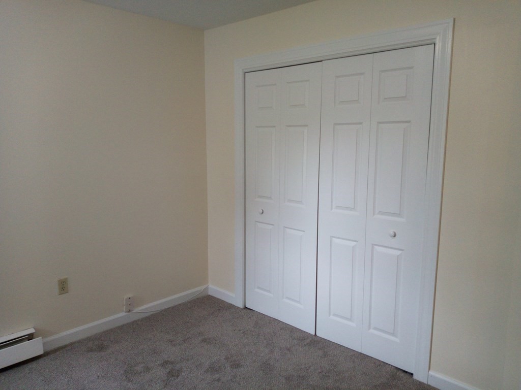 81 Mitchell Drive, Unit 81 Chicopee, MA 01022 - Photo 8 of 18 an empty room with closet area