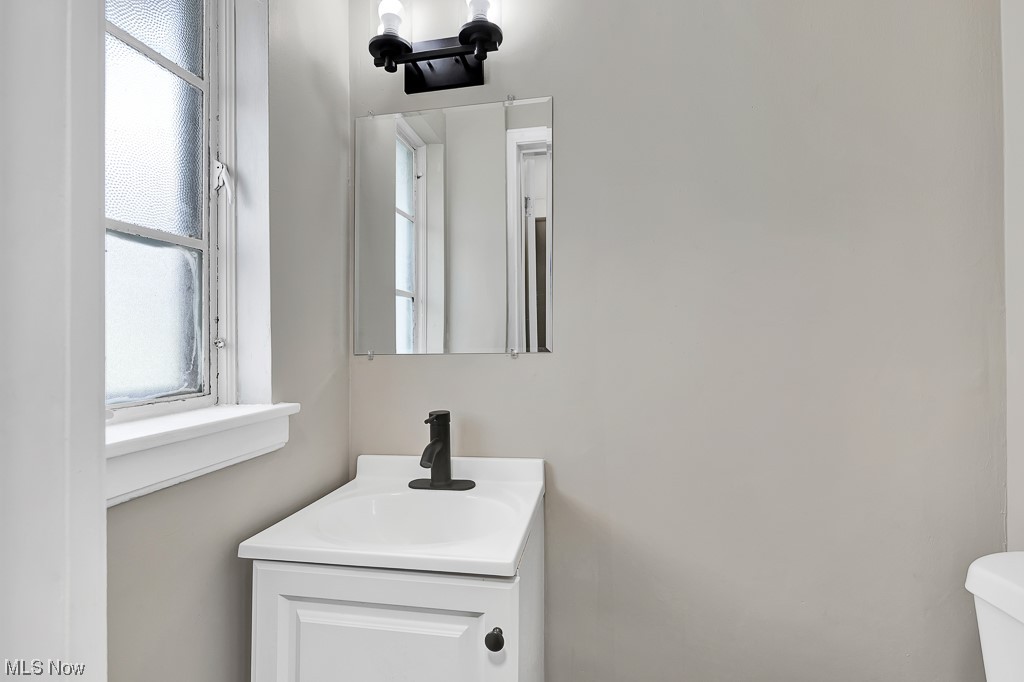 941 Pembrook Road Cleveland Heights, OH 44121 - Photo 10 of 24 Half Bathroom featuring toilet and vanity. First floor