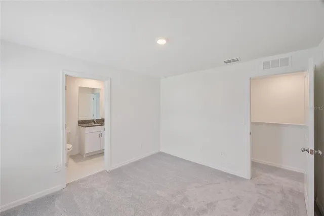 an empty room with a bathroom