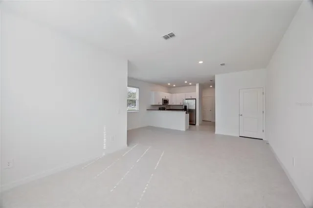a view of a kitchen with a sink and cabinets