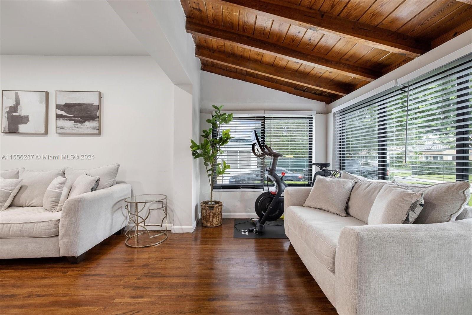 4631 Southwest 12th Street Miami, FL 33134 - Photo 2 of 28 a living room with furniture and a large window