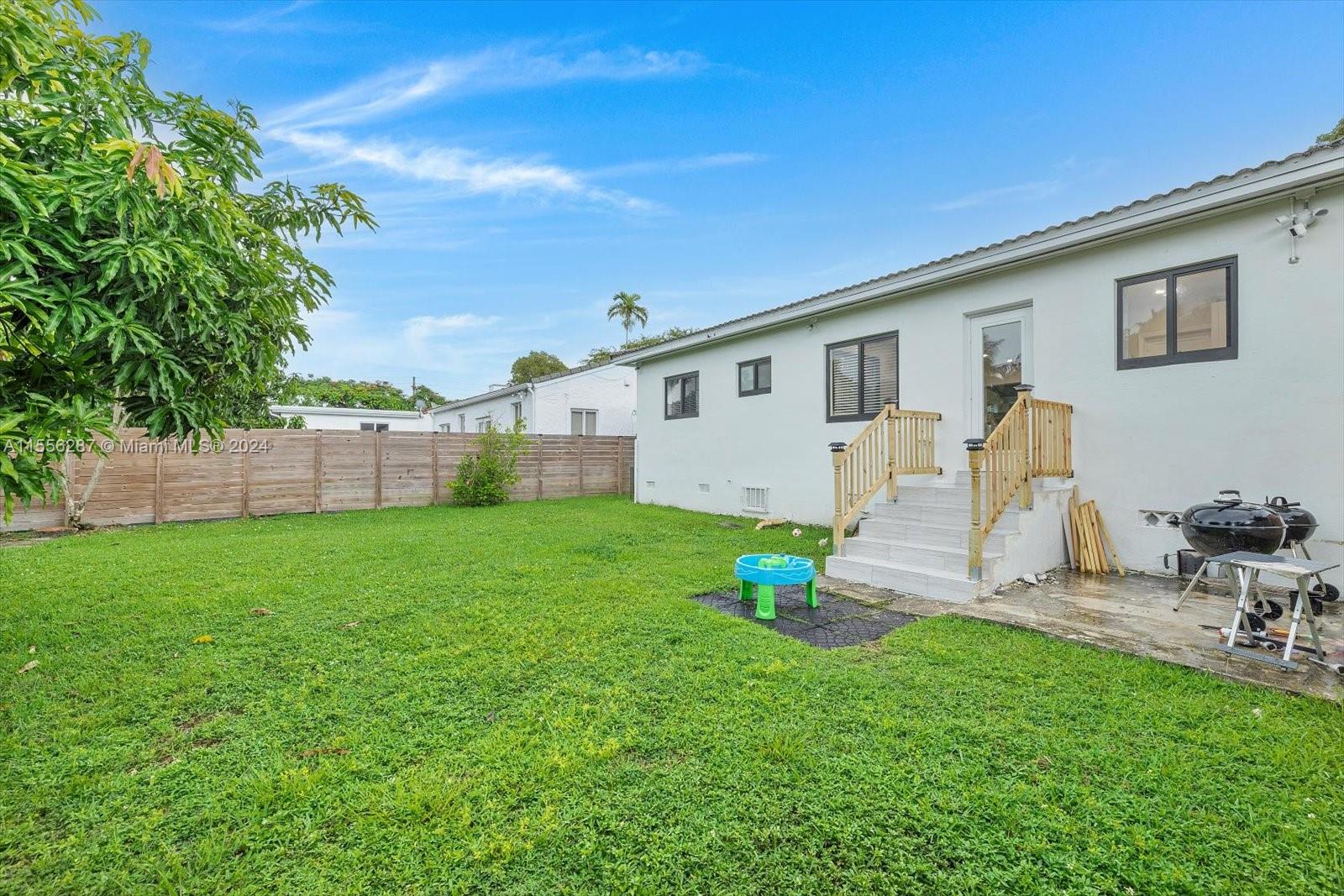 4631 Southwest 12th Street Miami, FL 33134 - Photo 23 of 28 a view of a backyard with plants and a garden