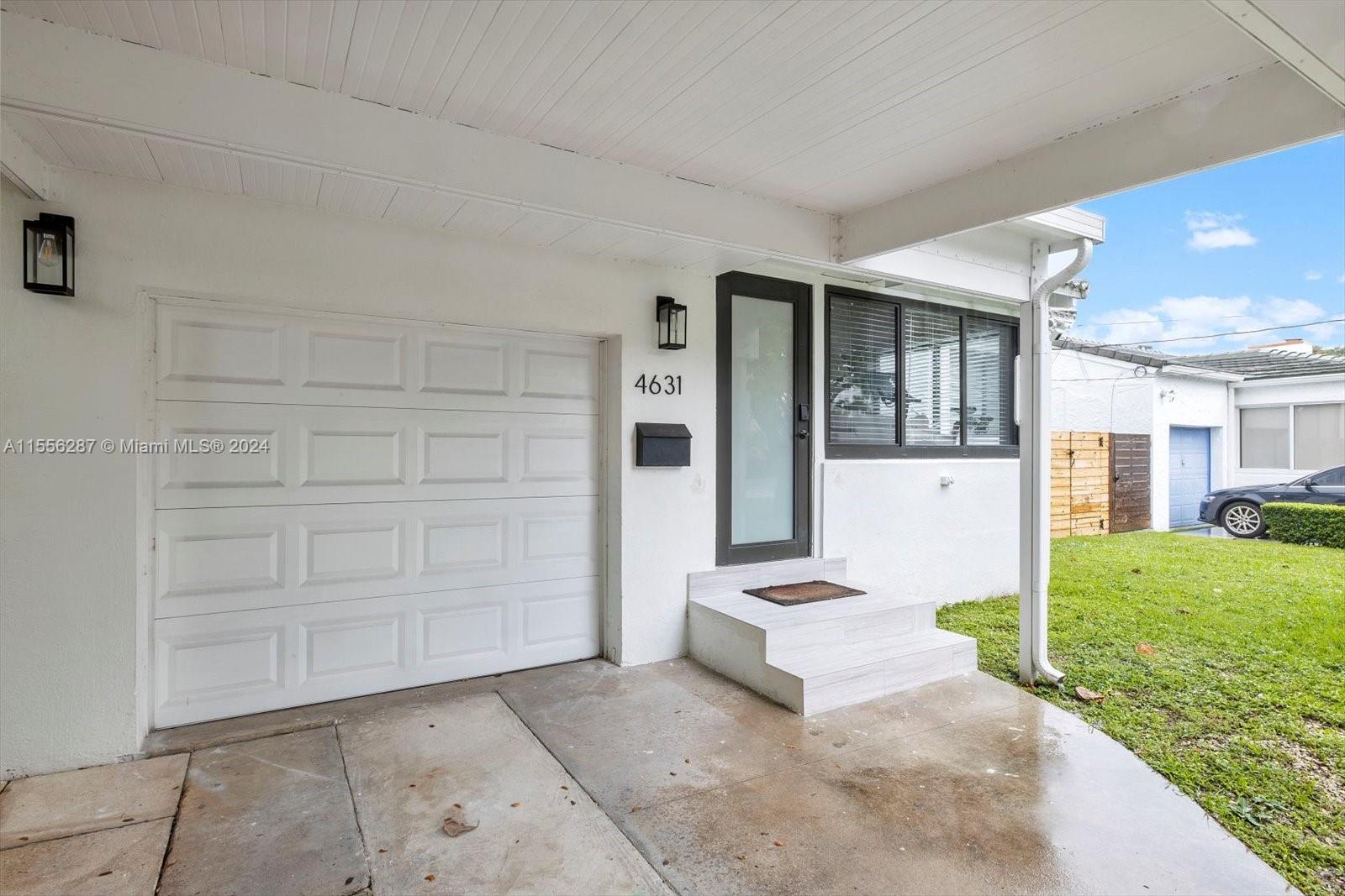 4631 Southwest 12th Street Miami, FL 33134 - Photo 24 of 28 a front view of a house with a yard