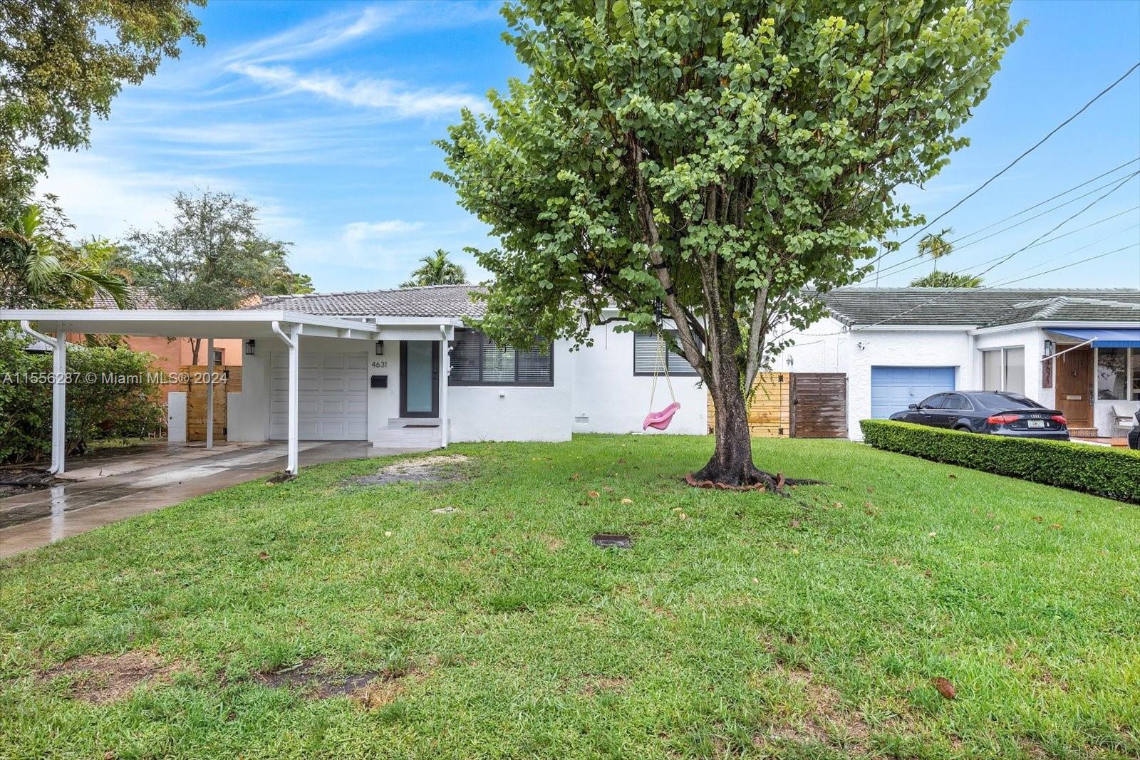 4631 Southwest 12th Street Miami, FL 33134 - Photo 25 of 28 front view of a house with a yard