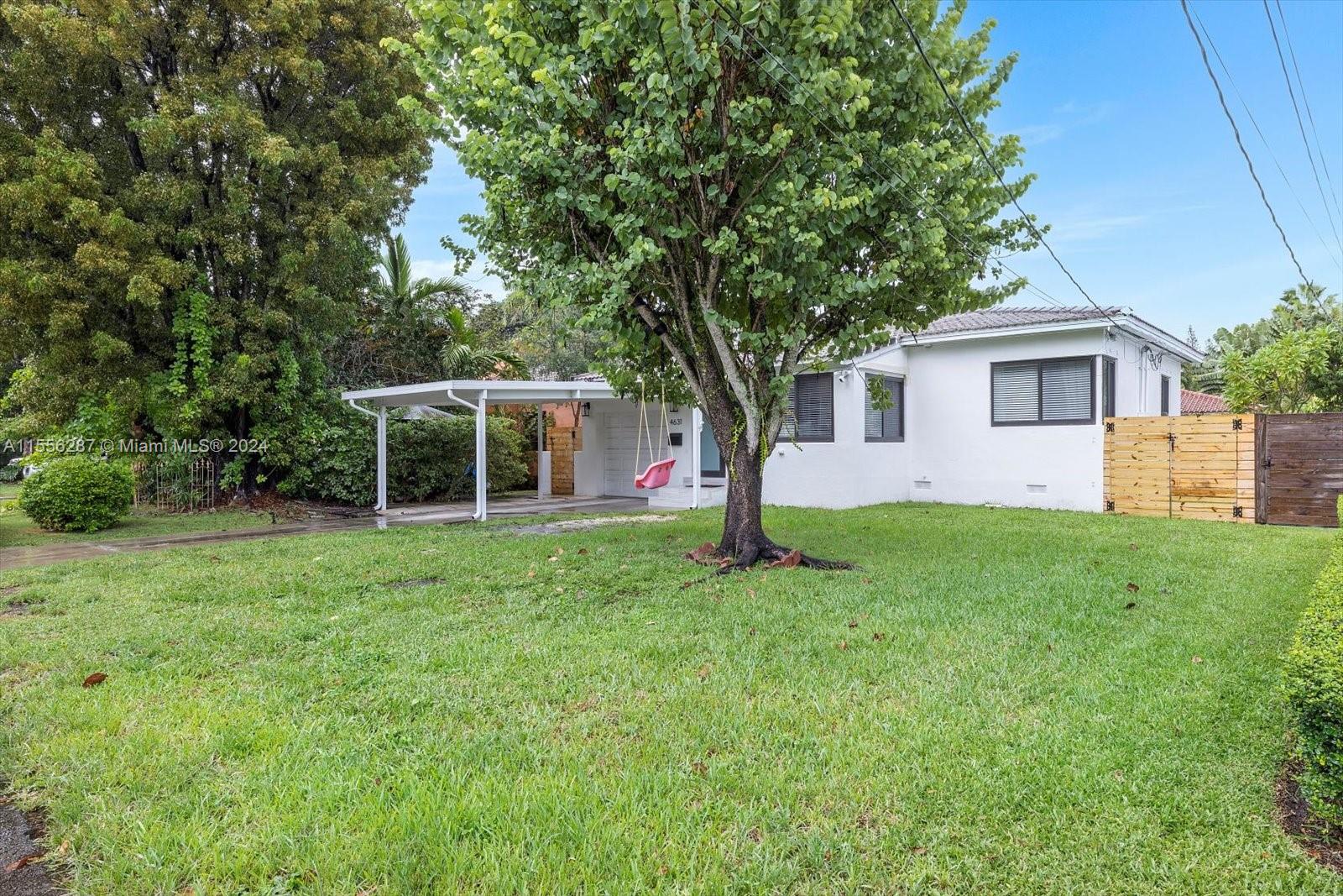4631 Southwest 12th Street Miami, FL 33134 - Photo 26 of 28 a view of backyard of house with green space