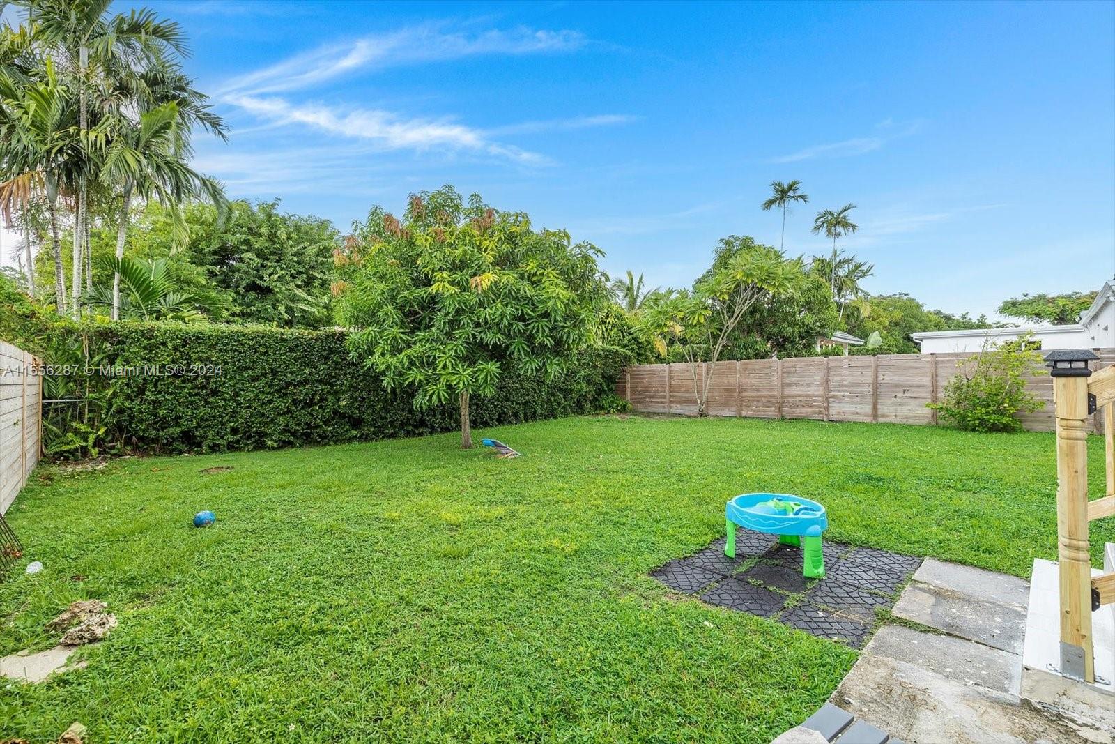 4631 Southwest 12th Street Miami, FL 33134 - Photo 27 of 28 a view of a table and chairs in the garden
