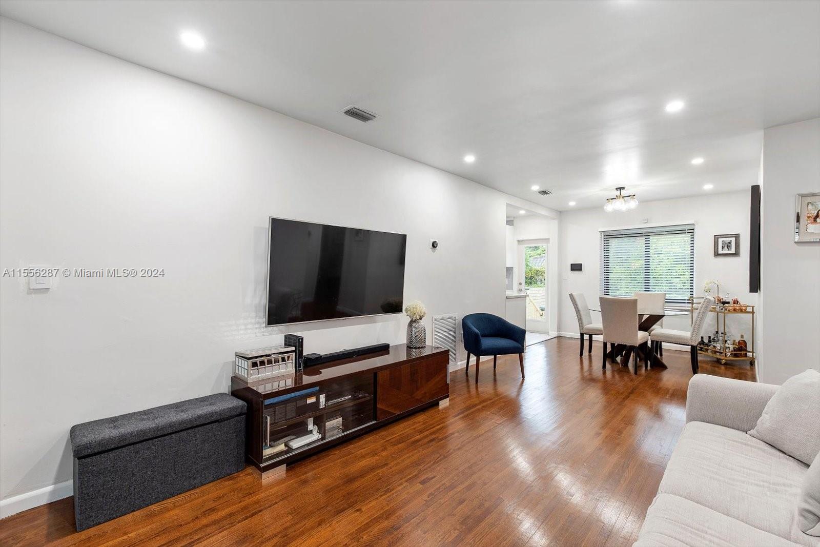 4631 Southwest 12th Street Miami, FL 33134 - Photo 4 of 28 a living room with furniture and a flat screen tv