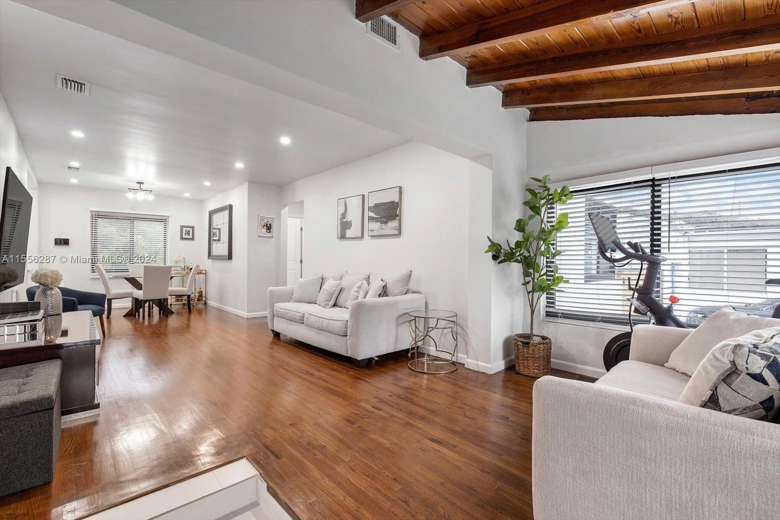 4631 Southwest 12th Street Miami, FL 33134 - Photo 6 of 28 a living room with furniture and wooden floor
