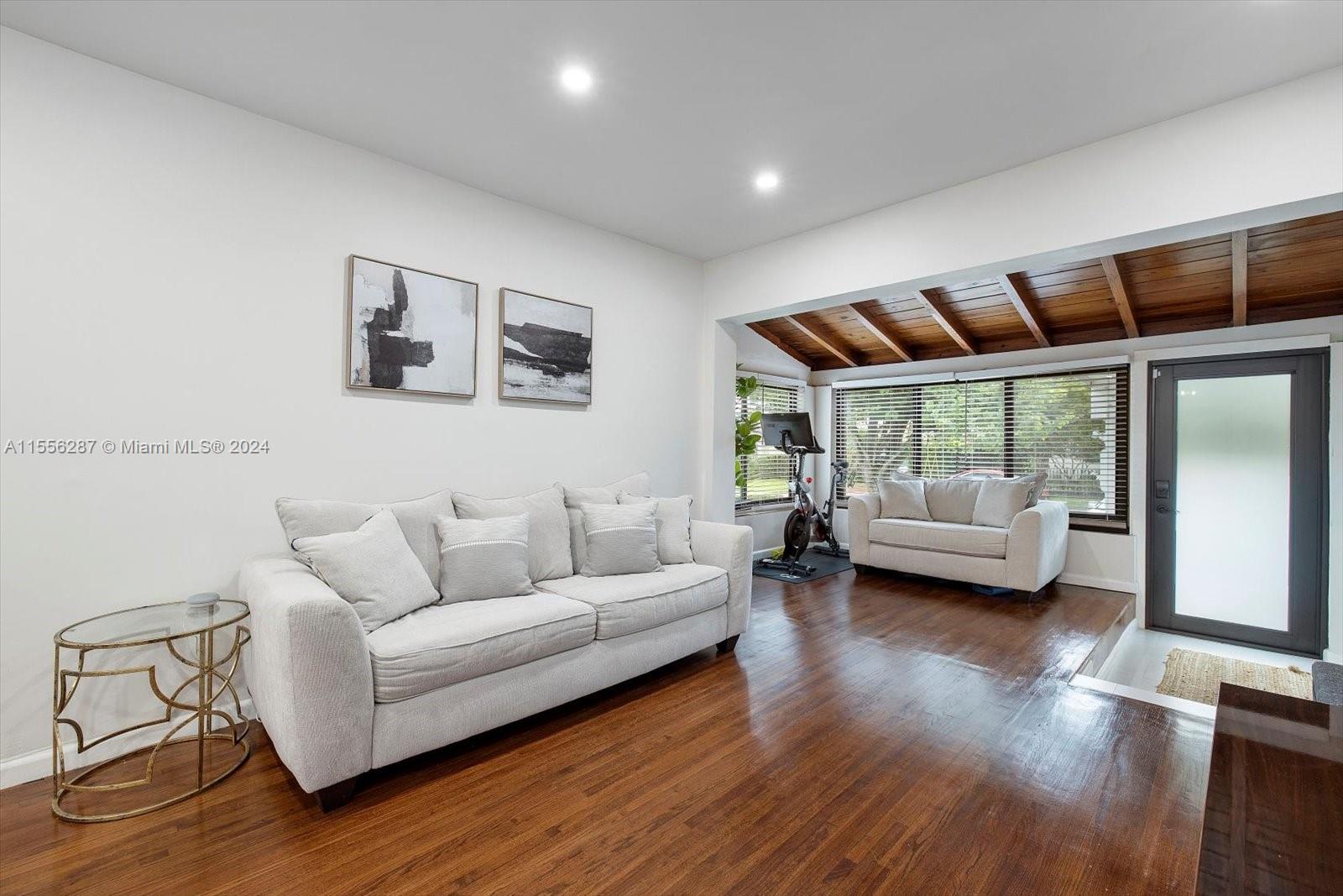 4631 Southwest 12th Street Miami, FL 33134 - Photo 7 of 28 a living room with furniture and a large window