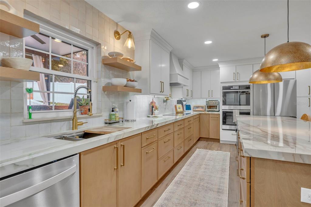 180 Spring Lake Hills Drive Altamonte Springs, FL 32714 - Photo 13 of 67 a kitchen with stainless steel appliances granite countertop a sink a stove and cabinets
