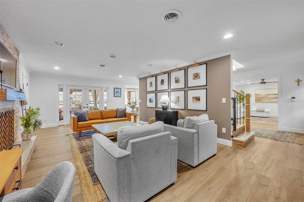 180 Spring Lake Hills Drive Altamonte Springs, FL 32714 - Photo 20 of 67 a living room with furniture and a wooden floor