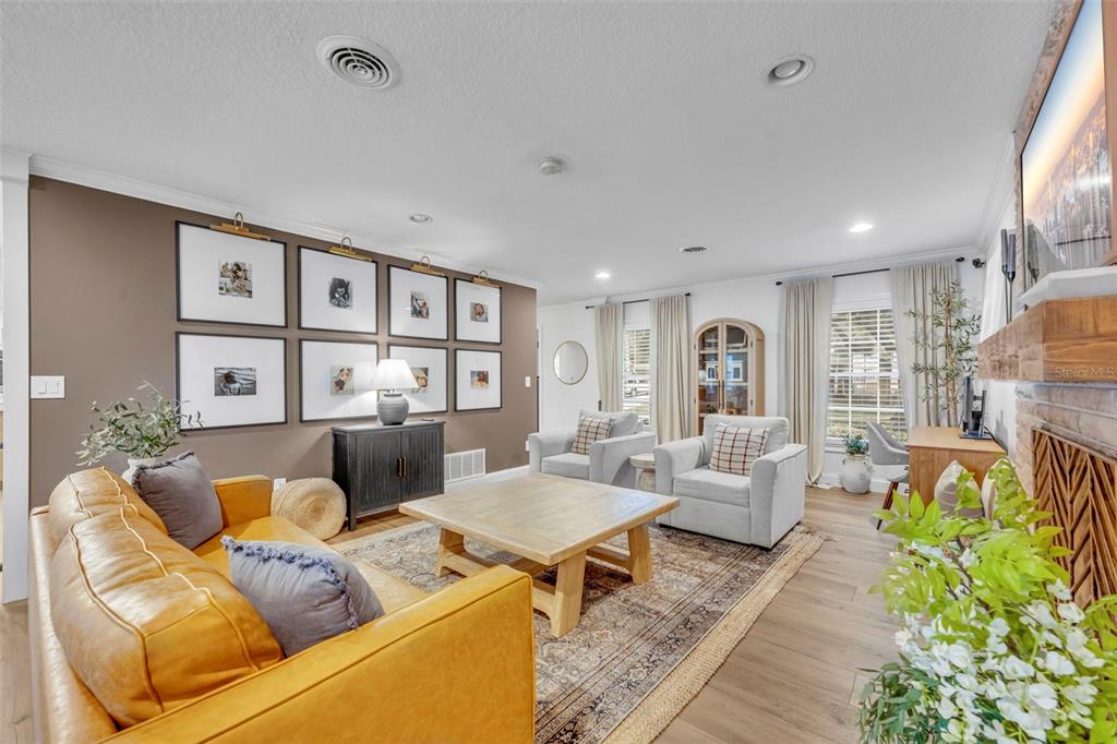 180 Spring Lake Hills Drive Altamonte Springs, FL 32714 - Photo 23 of 67 a living room with furniture and a large window