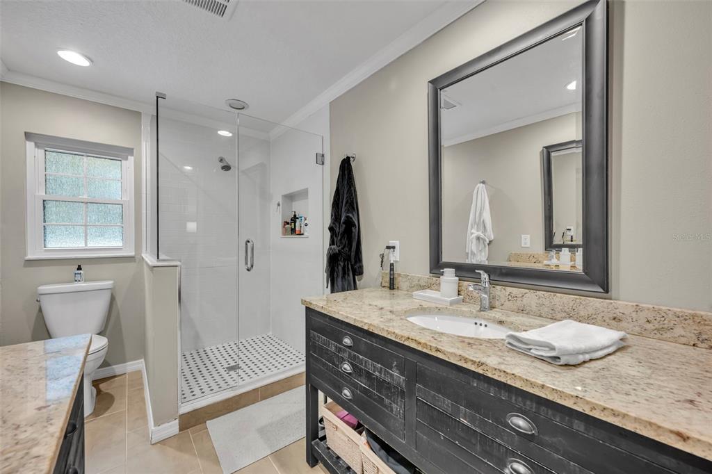 180 Spring Lake Hills Drive Altamonte Springs, FL 32714 - Photo 30 of 67 a bathroom with a granite countertop sink and a mirror