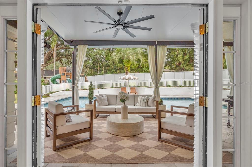 180 Spring Lake Hills Drive Altamonte Springs, FL 32714 - Photo 36 of 67 a living room with furniture and a large window