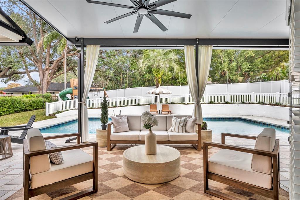 180 Spring Lake Hills Drive Altamonte Springs, FL 32714 - Photo 37 of 67 a living room with furniture and a large window