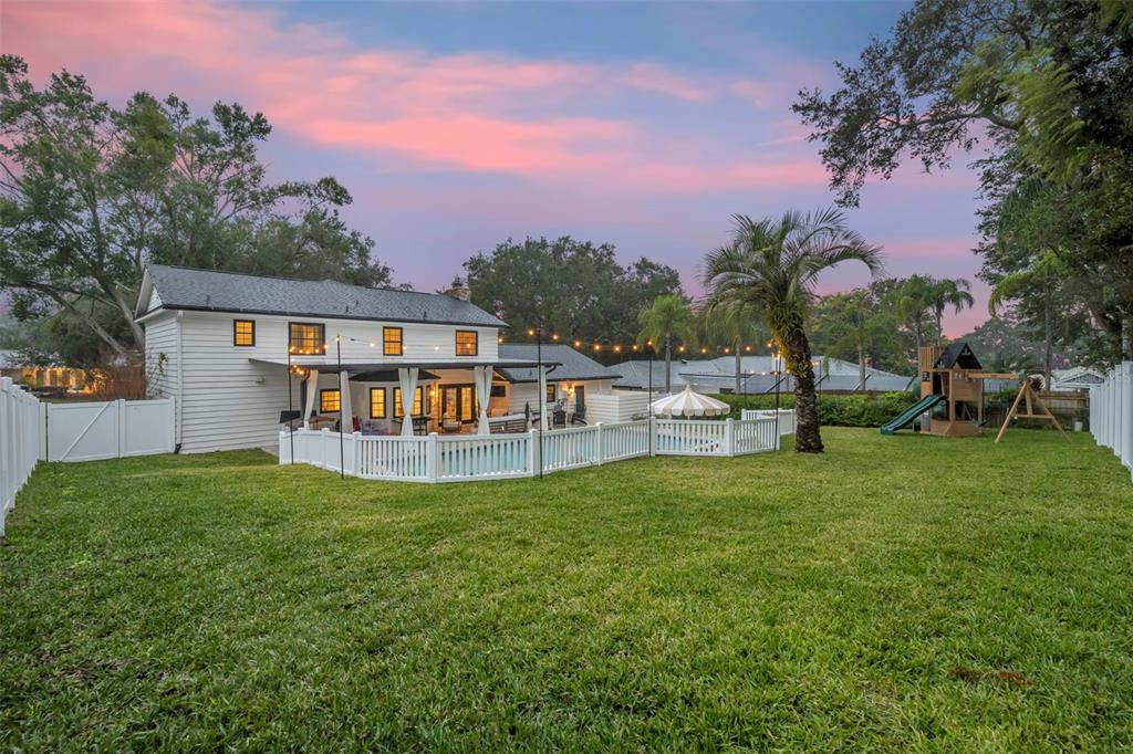 180 Spring Lake Hills Drive Altamonte Springs, FL 32714 - Photo 51 of 67 a view of a house with a backyard porch and sitting area