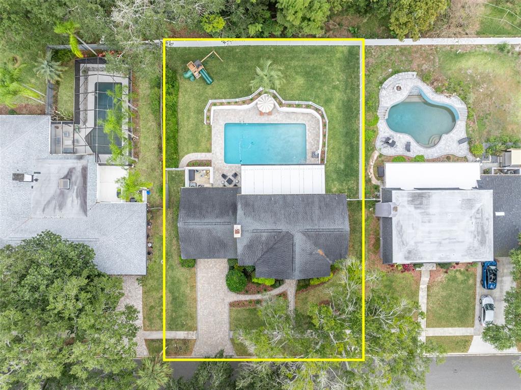 180 Spring Lake Hills Drive Altamonte Springs, FL 32714 - Photo 56 of 67 an aerial view of a house with a yard