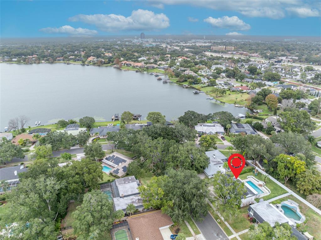 180 Spring Lake Hills Drive Altamonte Springs, FL 32714 - Photo 58 of 67 an aerial view of residential building and lake