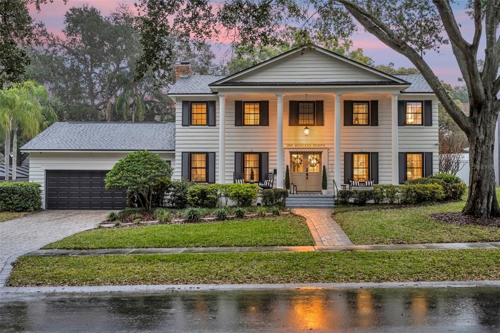 180 Spring Lake Hills Drive Altamonte Springs, FL 32714 - Photo 67 of 67 a front view of a house with a yard and lake view