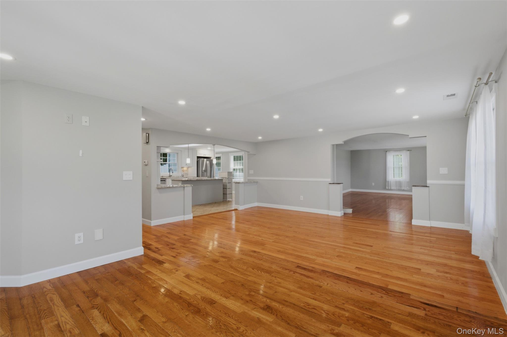 12 Leeside Road Carmel, NY 10512 - Photo 12 of 44 Spacious family room area featuring wood-finish flooring, recessed lighting, and a neutral color palette