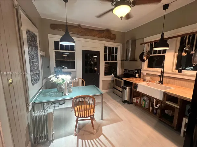 a dining room with furniture and chandelier