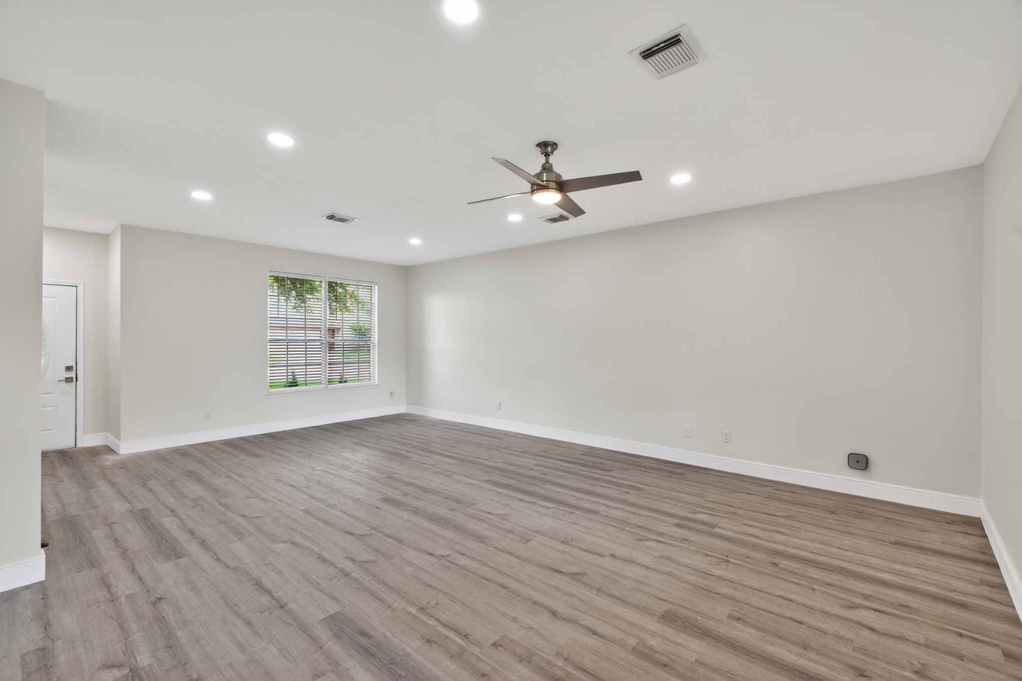 918 Ivycroft Lane Spring, TX 77373 - Photo 8 of 33 wooden floor in an empty room with a window