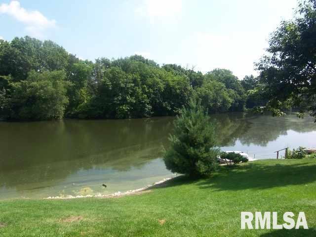 a view of a lake with a big yard