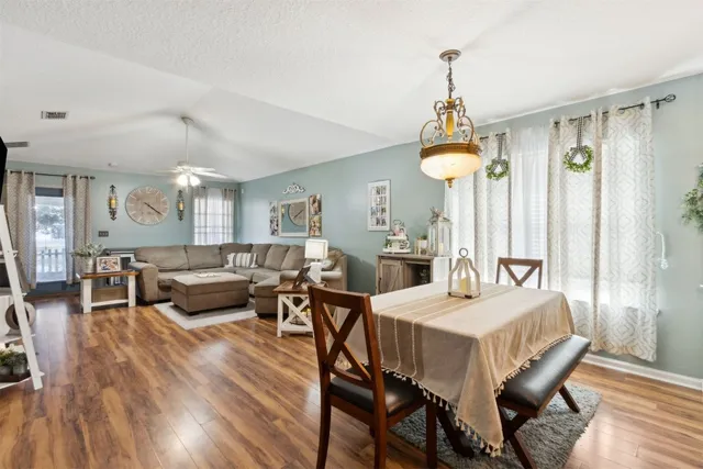 a bed room with a bed and a chair