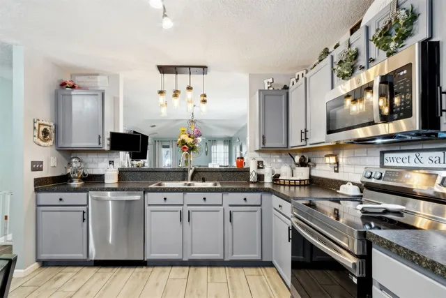 a view of swimming pool with outdoor seating and plants