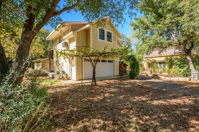 a house with a tree in front of it