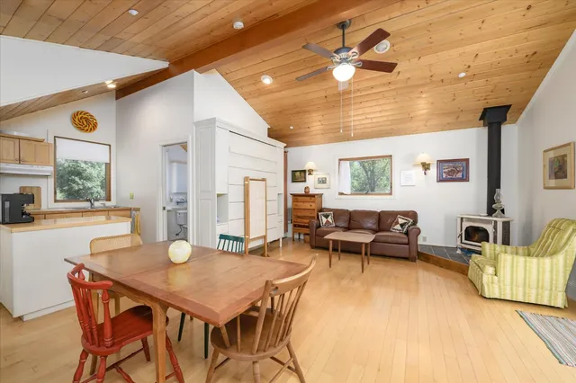 a living room with furniture a table and a chandelier