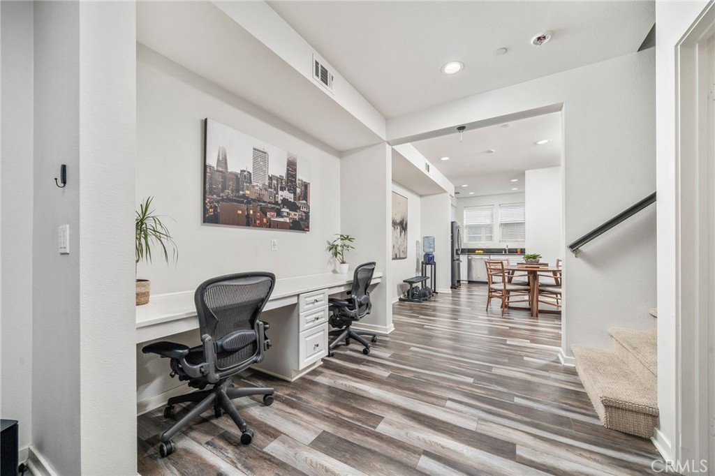 8836 Jacaranda Avenue, Unit D Montclair, CA 91763 - Photo 1 of 26 a view of a workspace with furniture and a window