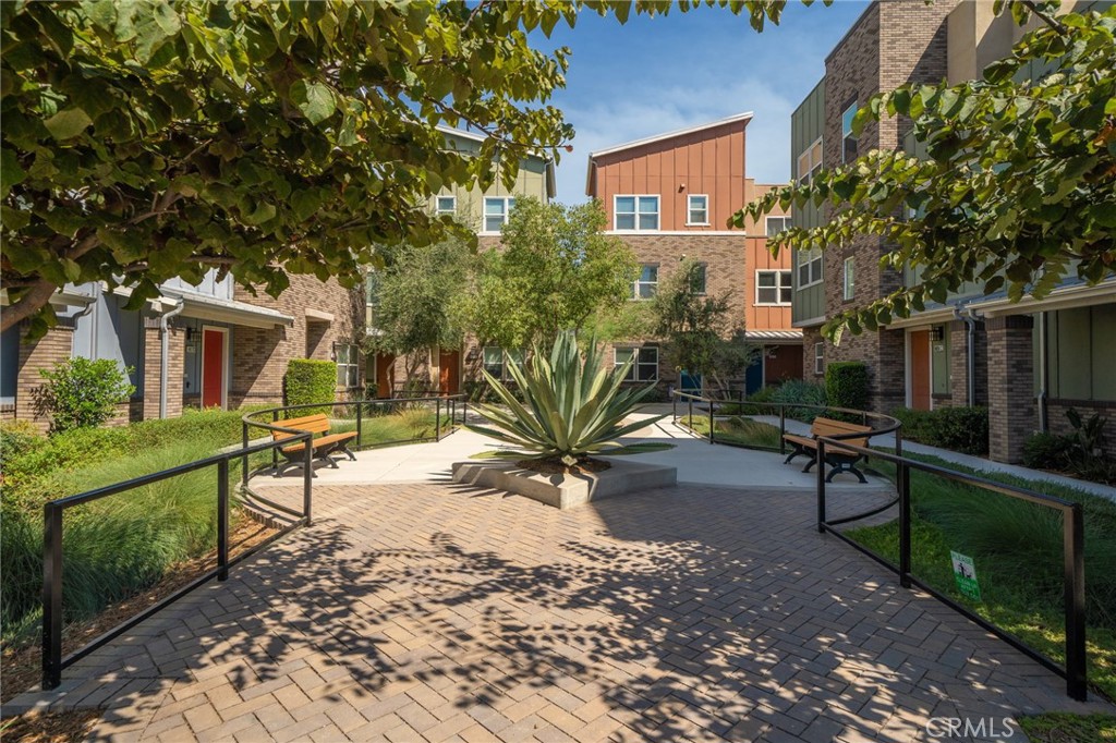 8836 Jacaranda Avenue, Unit D Montclair, CA 91763 - Photo 22 of 26 a view of a house with backyard and sitting area