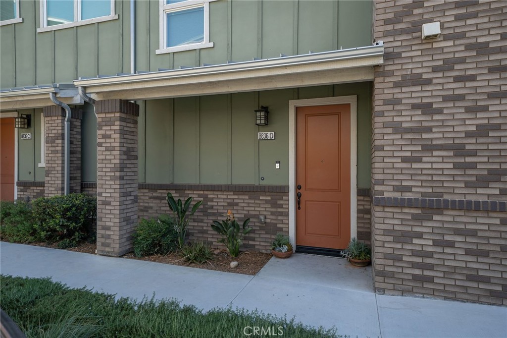 8836 Jacaranda Avenue, Unit D Montclair, CA 91763 - Photo 26 of 26 a front view of a house with plants