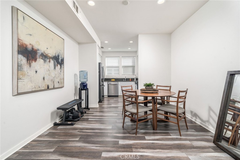 8836 Jacaranda Avenue, Unit D Montclair, CA 91763 - Photo 6 of 26 a view of a dining room with furniture and wooden floor