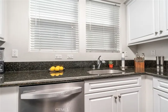 a kitchen with a sink and a window