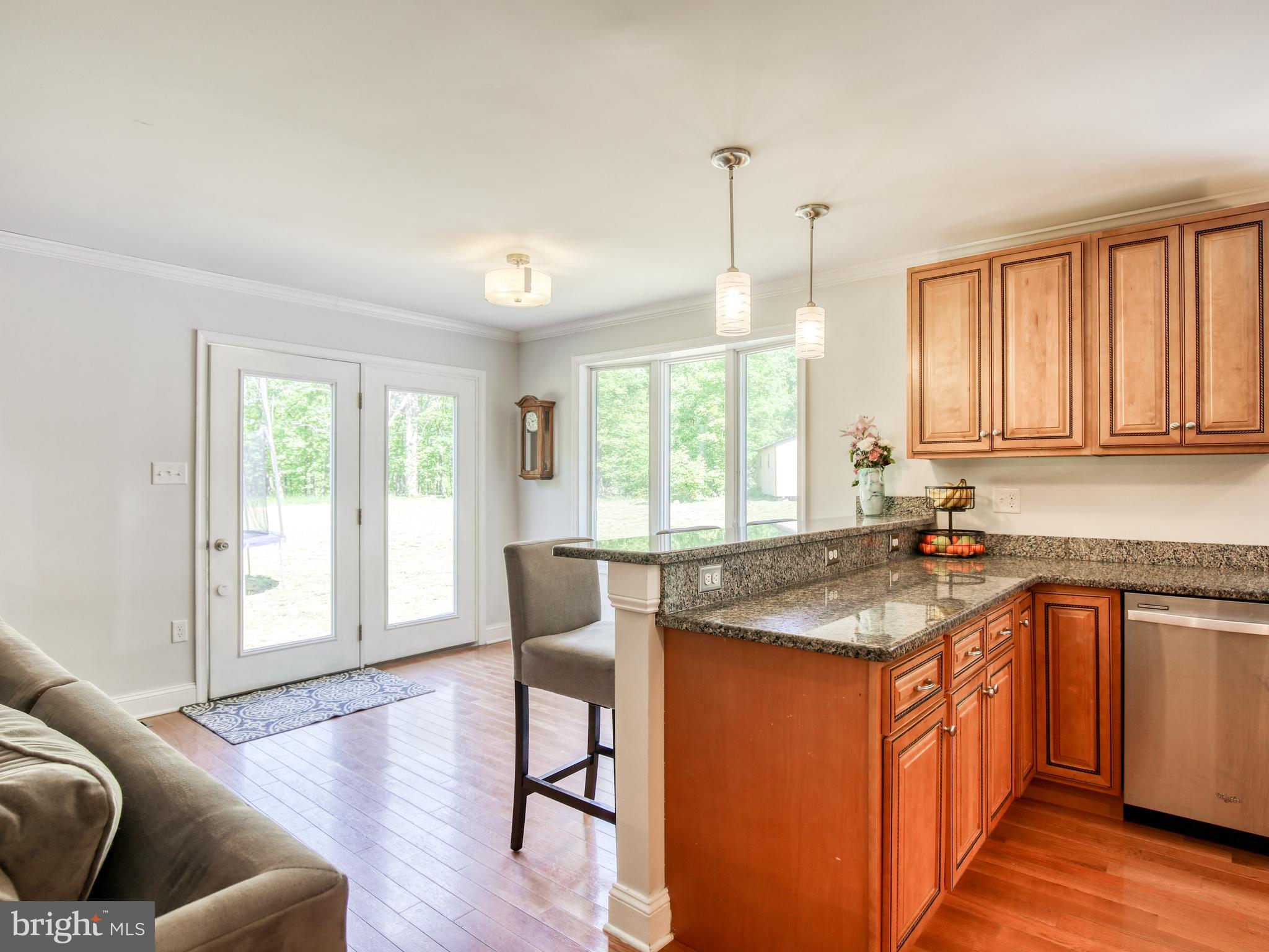 959 Adams Road Winchester, VA 22603 - Photo 13 of 42 Eat in kitchen with kitchen table space behind bar