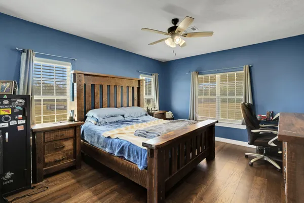 a bedroom with a bed and a table in it