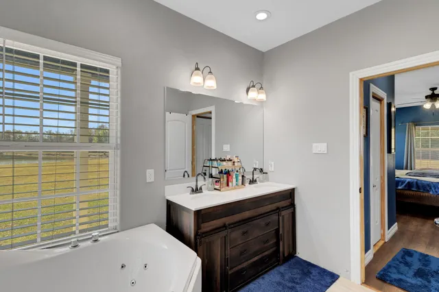 a bathroom with a sink double vanity and a mirror