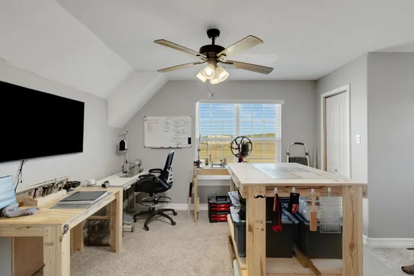 a room with furniture and a flat screen tv