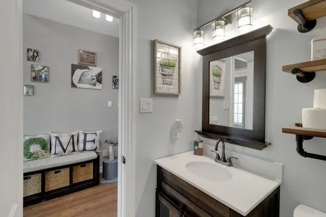 a en suite bathroom with a sink and a mirror