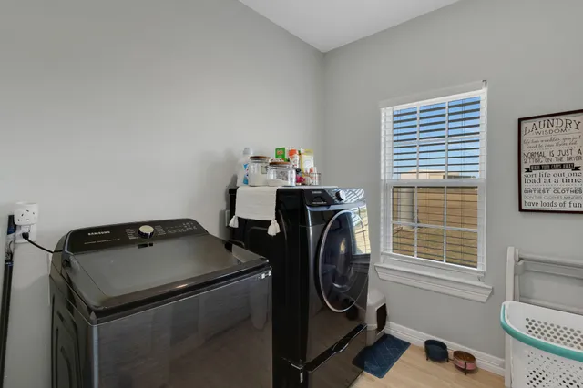 a utility room with dryer and washer