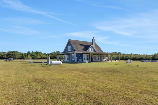 a front view of a house with yard