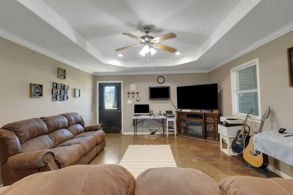 a living room with furniture and a flat screen tv