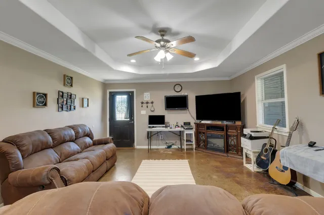 a living room with furniture and a flat screen tv