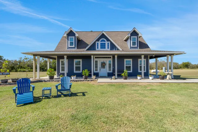 a view of a house with swimming pool and porch