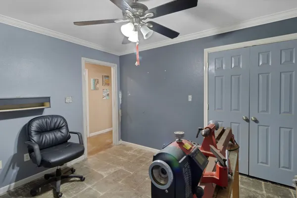 a bedroom with a workspace