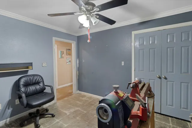 a bedroom with a workspace